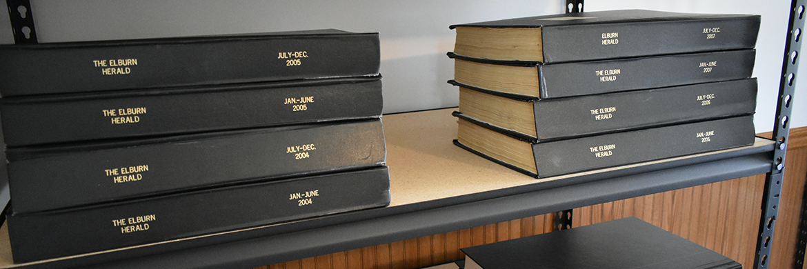 Herald Archive binders on a shelf