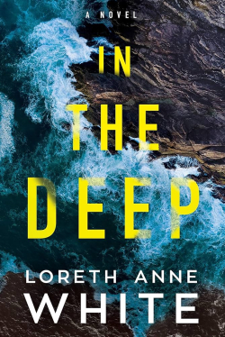 An ocean wave crashes against rocks.