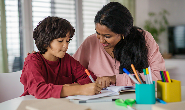 Mom helping her son with homework