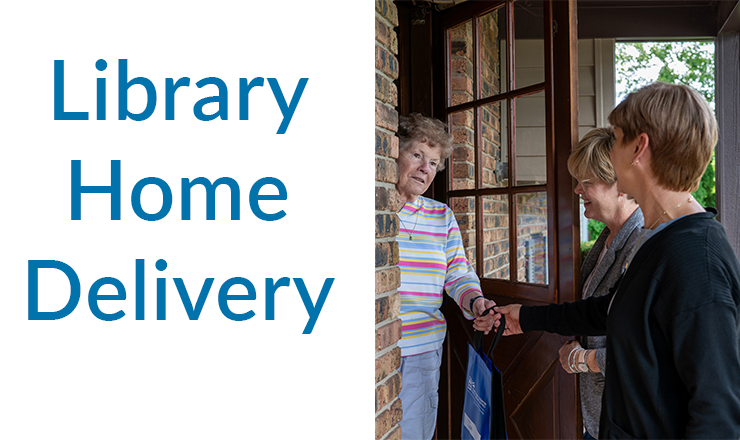 Outreach librarians hand a bag to a patron at her home.